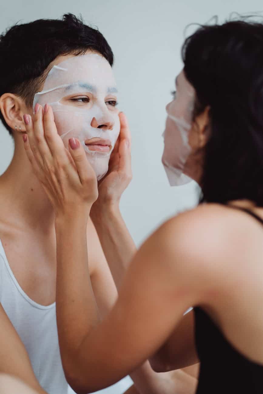 couple touching face masks